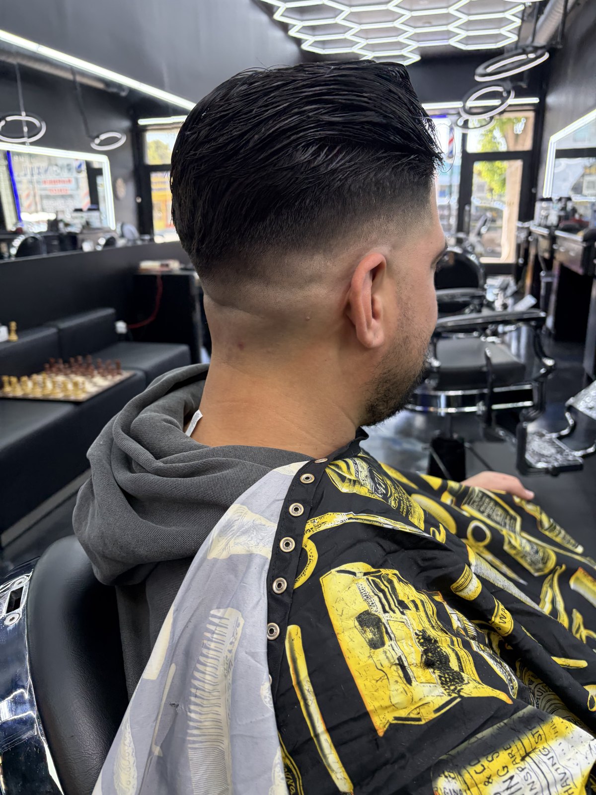 Barber at work at OB Barbershop
